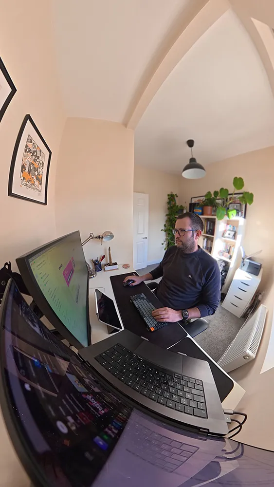 Jozsef Szabics at his desk, working across multiple screens